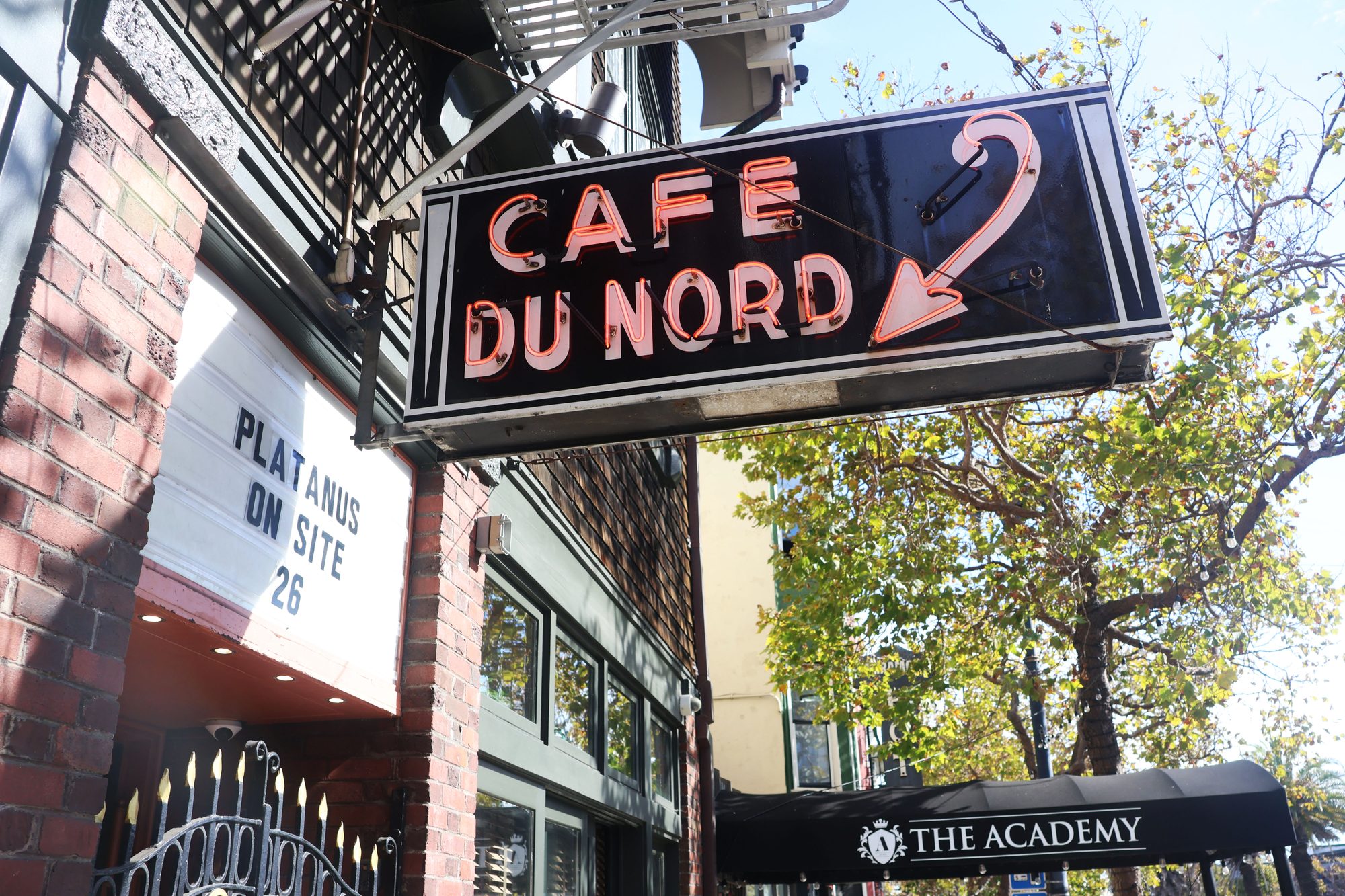 Café du Nord neon sign and marquee reading Platanus On Site 26 on Market Street, San Francisco